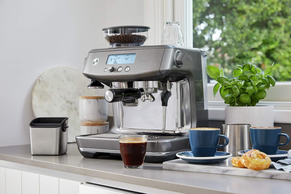 Breville Barista Pro steam wand preparing microfoam milk for latte art.