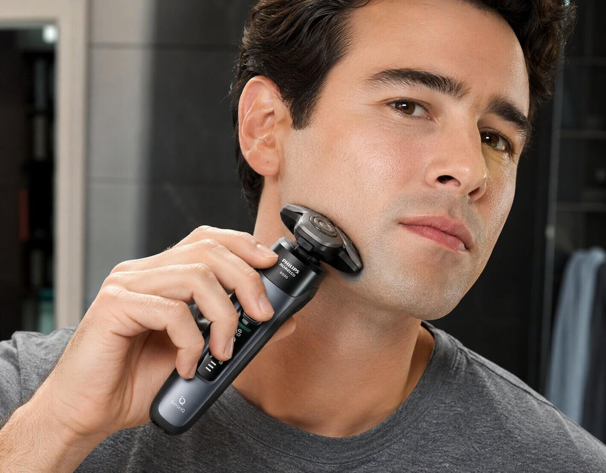 Philips Norelco i9000 rotary shaver demonstrating Triple Action Lift and Cut technology