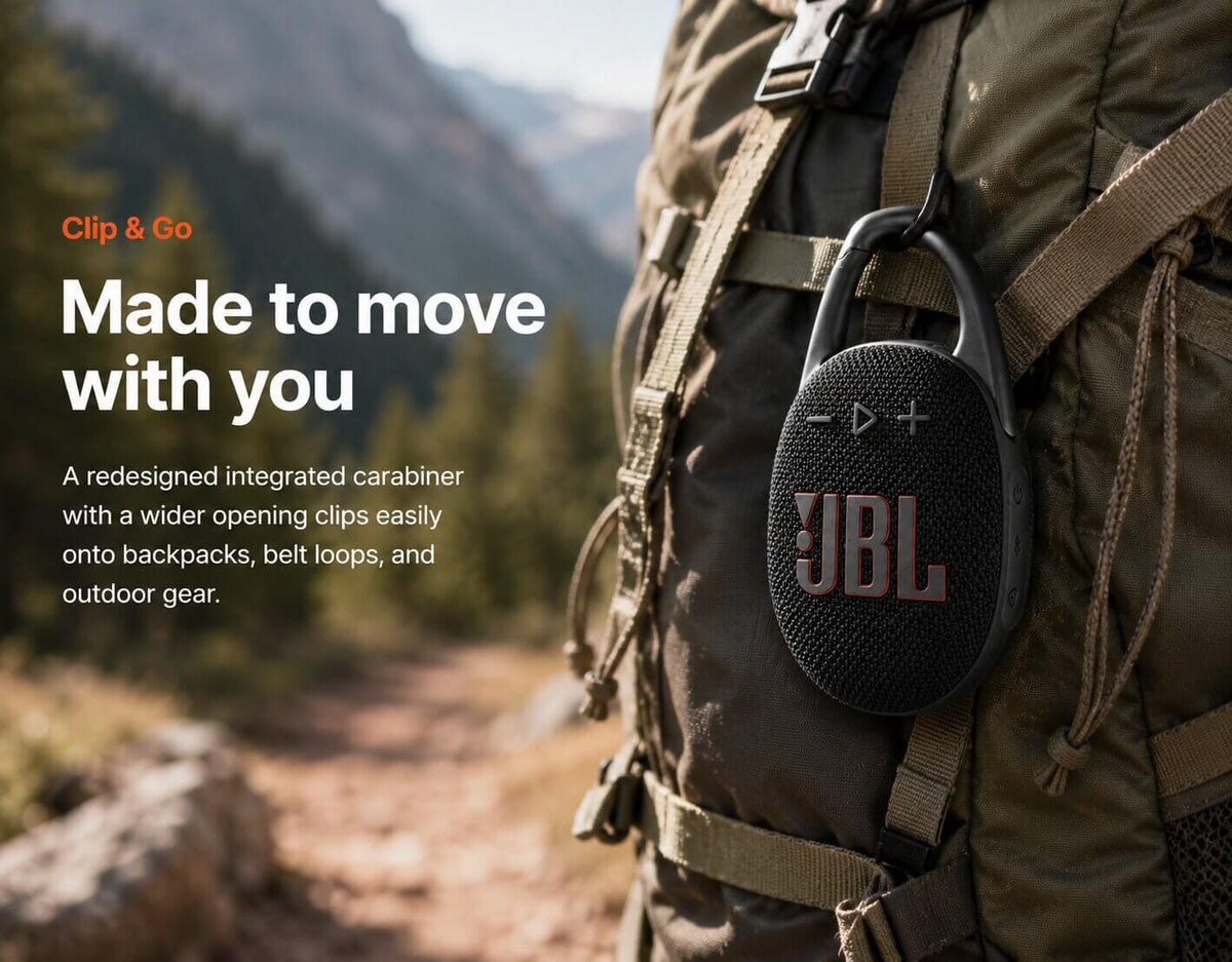 JBL Clip 5 black portable speaker clipped onto a backpack outdoors