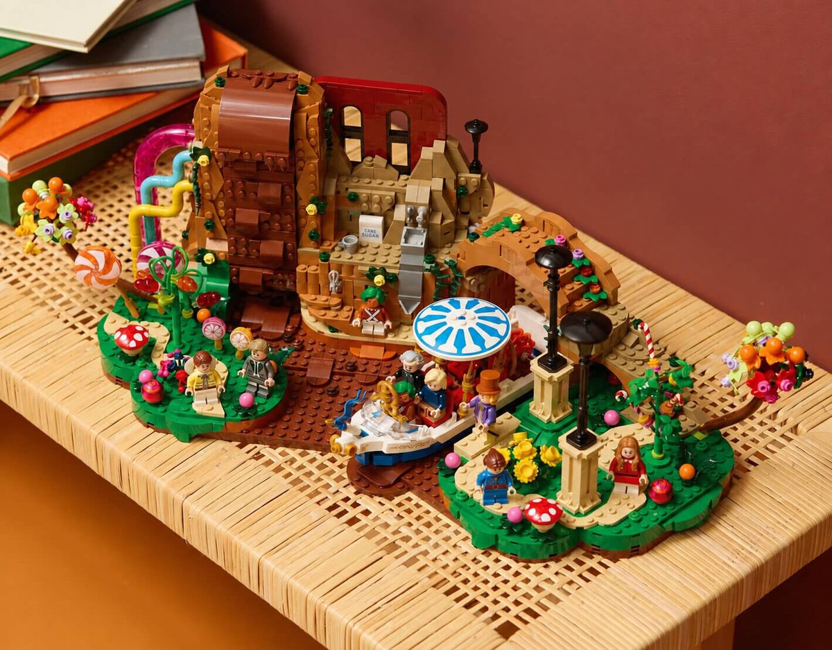LEGO Ideas Willy Wonka and the Chocolate Factory 21360 colorful factory display with chocolate waterfall, Wonkatania boat and minifigures